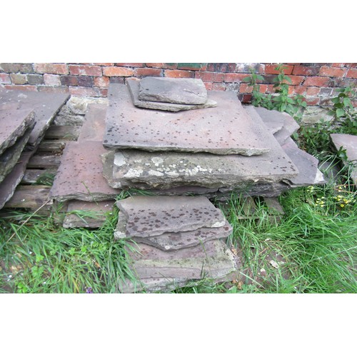 1221 - A large area of natural stone paving slabs