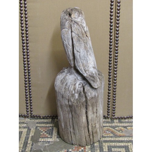 1150 - A large weathered carved oak barn owl, with provenance from the International Centre for Birds of Pr... 