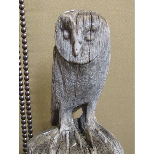 1150 - A large weathered carved oak barn owl, with provenance from the International Centre for Birds of Pr... 