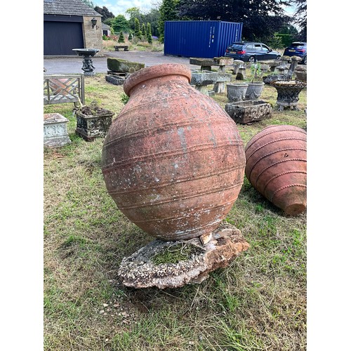 1101 - A very large combed weathered terracotta olive jar / vessel, 120cm high, mouth diameter 48cm. 

From... 