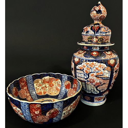 76 - A 19th century oviform Imari vase and cover (af) a further Imari bowl and a Chinese export meat plat... 