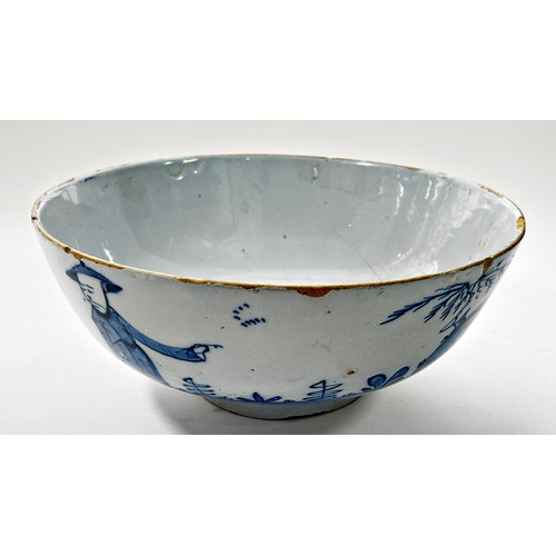 111 - An 18th century Liverpool blue and white Delft bowl, decorated with a Chinese character in landscape... 