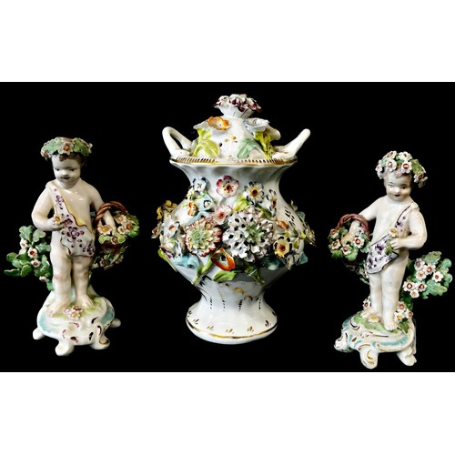 6 - A Coalport floral encrusted vase and cover, 14cm high, together a pair of late 18th century figures ... 