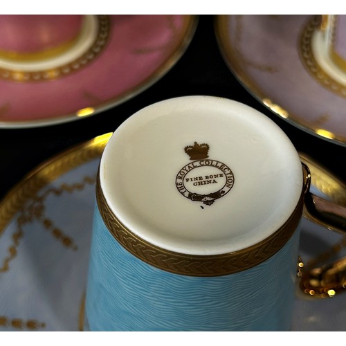 14 - A set of six bone china coffee cups and saucers in various colourways, with gilt overlay - The Royal... 