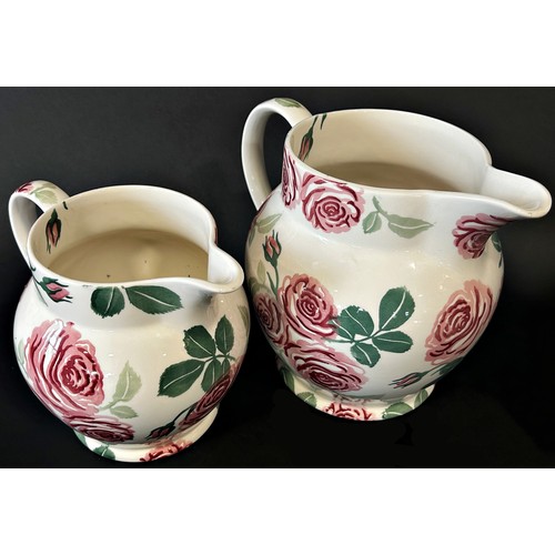 22 - Two graduated Emma Bridgewater jugs with rose detail; 6 pint example (21cm) and smaller (2)