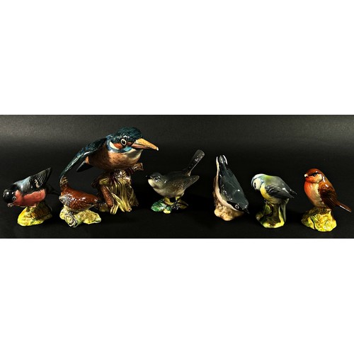 102 - A collection of Beswick birds including a Kingfisher, a cock pheasant, 1226, and further wild birds ... 