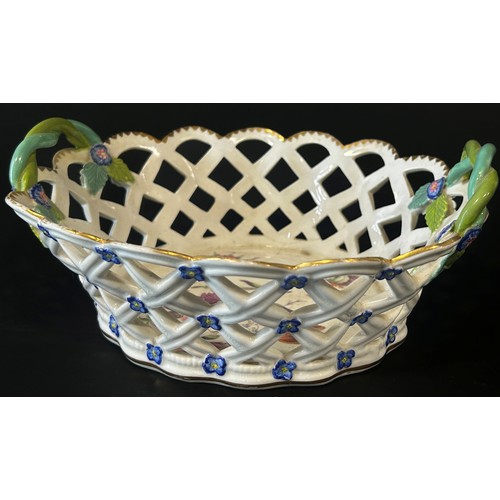 25 - A 19th century lattice work basket with hand painted floral panels