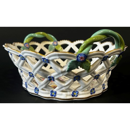 25 - A 19th century lattice work basket with hand painted floral panels