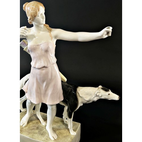 10 - A Goldschnider ceramic figure of a huntress and hound (af) 60cm tall approx