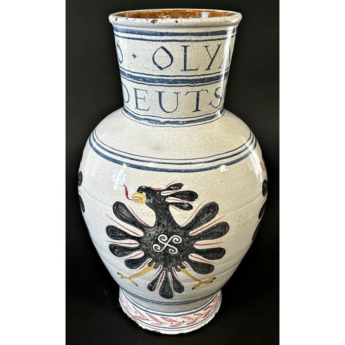 24 - A large 1936 German Olympic Stoneware vase, with hand painted detail and script, 52cm high.