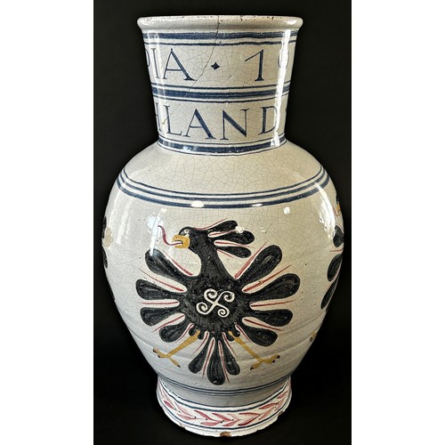 24 - A large 1936 German Olympic Stoneware vase, with hand painted detail and script, 52cm high.