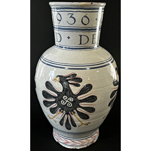 24 - A large 1936 German Olympic Stoneware vase, with hand painted detail and script, 52cm high.