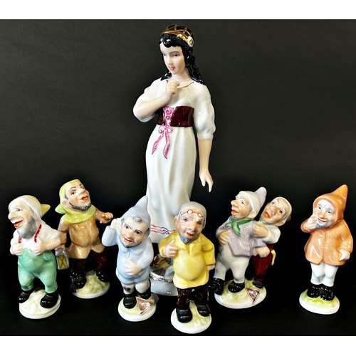 34 - A Royal Dux group - Snow White and the Seven Dwarves, 21cm high and smaller (7)