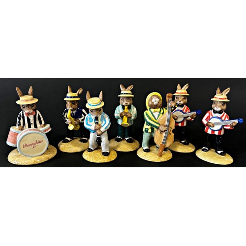 42 - A collection of Royal Doulton Bunnykins from The Jazz Band collection, limited edition 2500, (7)