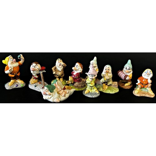 39 - A collection of 10 Royal Doulton 'Disney's Showcase Collection Snow White and the Seven Dwarves' cha... 