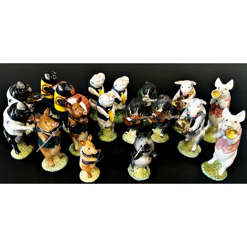 41 - A collection of Beswick Pig Promenade Band figures, some with certificates (18)