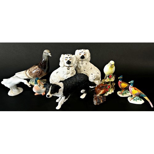 23 - A collection of Beswick and other animals including a pigeon, no.1383, pigs, sheep, goat, etc, toget... 