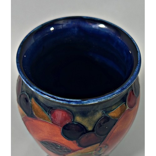 32 - A Moorcroft vase in the Pomegranate pattern, with Moorcroft signature to base, 20cm high