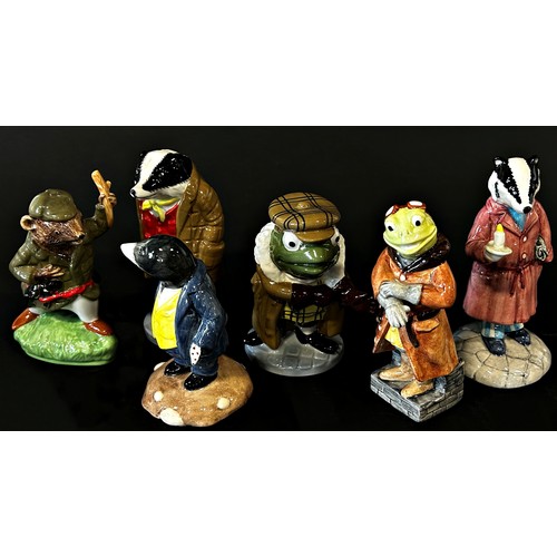 29 - A collection of 13 characters from The Wind in the Willows by Beswick, Royal Albert and Wade potteri... 