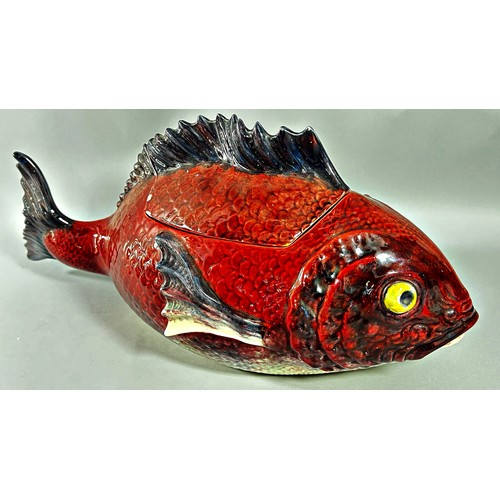 37 - A majolica tureen and cover in the form of a fish, red ground body, 48cm long