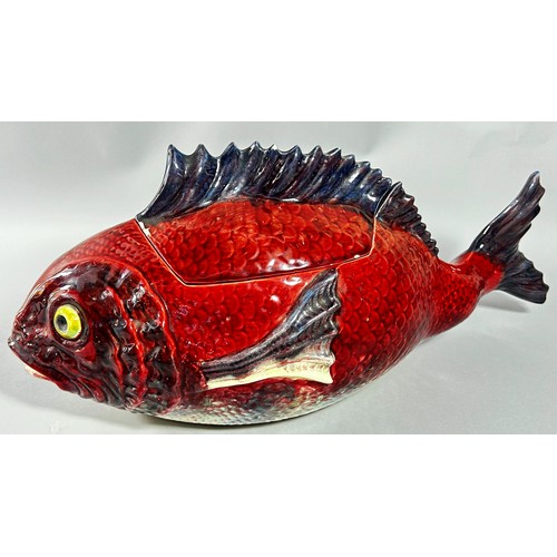 37 - A majolica tureen and cover in the form of a fish, red ground body, 48cm long