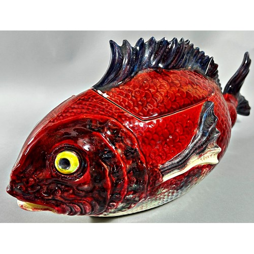 37 - A majolica tureen and cover in the form of a fish, red ground body, 48cm long