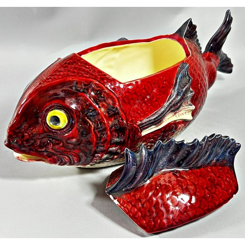 37 - A majolica tureen and cover in the form of a fish, red ground body, 48cm long