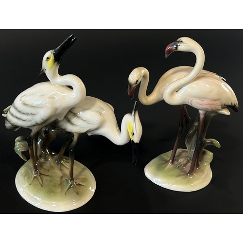 33 - A collection of bird related ornaments including Herons and Flamingos, Goebel Golden Oriel, fighting... 