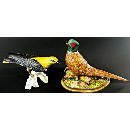 33 - A collection of bird related ornaments including Herons and Flamingos, Goebel Golden Oriel, fighting... 