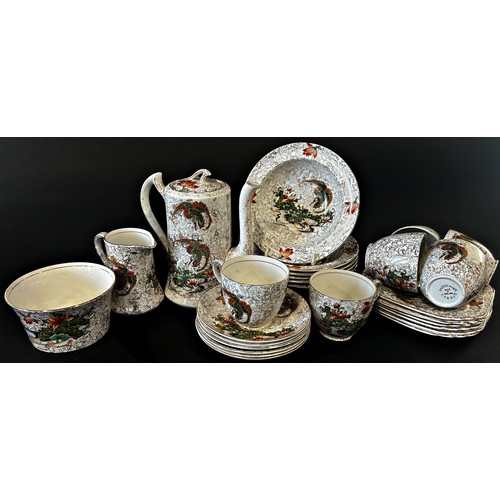 38 - A Phoenix ware coffee service comprising coffee pot, cream jug, sugar bowl, six coffee cups and sauc... 