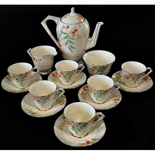 55 - A Paragon coffee service for six with floral detail within gilt bands