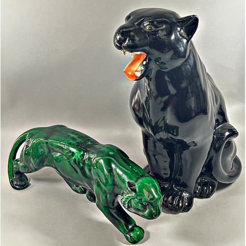 163 - Two panthers, one in a black colourway 50cm tall and a further example in green glaze, 45cm long