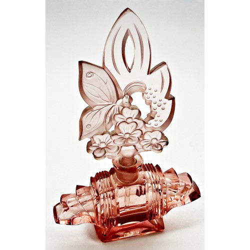 184 - An Art Deco pink glass scent bottle, with floral engraved stopper and intact dabber , 20.5cm high x ... 