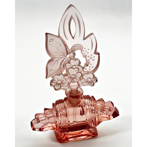 184 - An Art Deco pink glass scent bottle, with floral engraved stopper and intact dabber , 20.5cm high x ... 