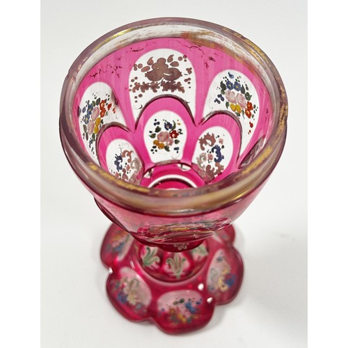 185 - A Bohemian faceted pink glass goblet with hand painted floral decoration, together with a cover, 22c... 