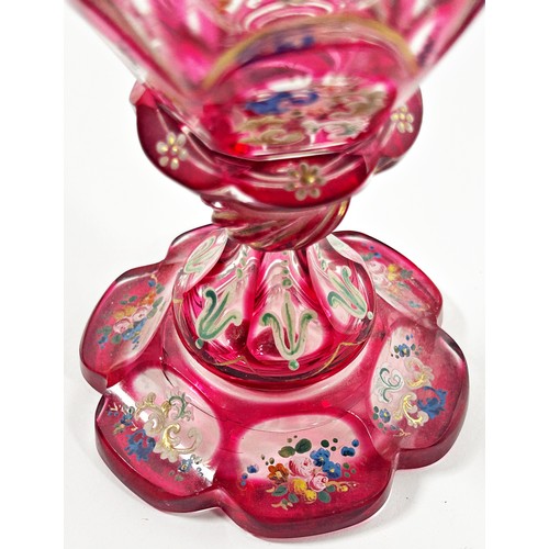 185 - A Bohemian faceted pink glass goblet with hand painted floral decoration, together with a cover, 22c... 