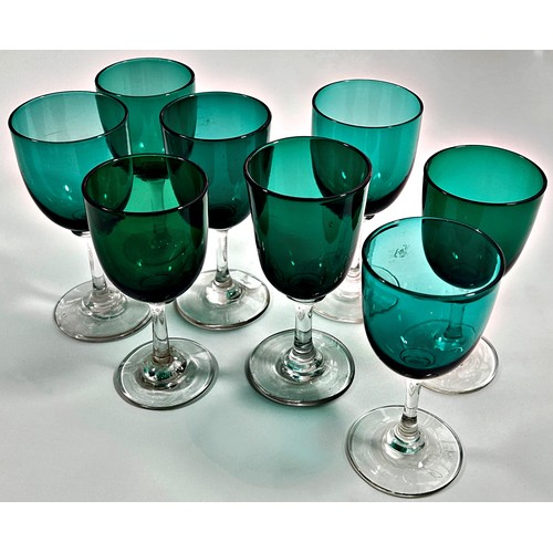 203 - Eight Victorian green glass wine glasses, three at 13.5cm high and five similar at 13cm high.