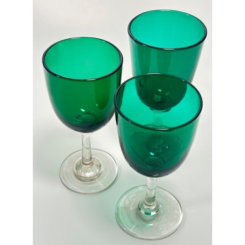 203 - Eight Victorian green glass wine glasses, three at 13.5cm high and five similar at 13cm high.