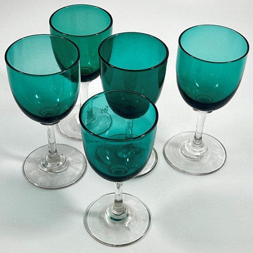 203 - Eight Victorian green glass wine glasses, three at 13.5cm high and five similar at 13cm high.