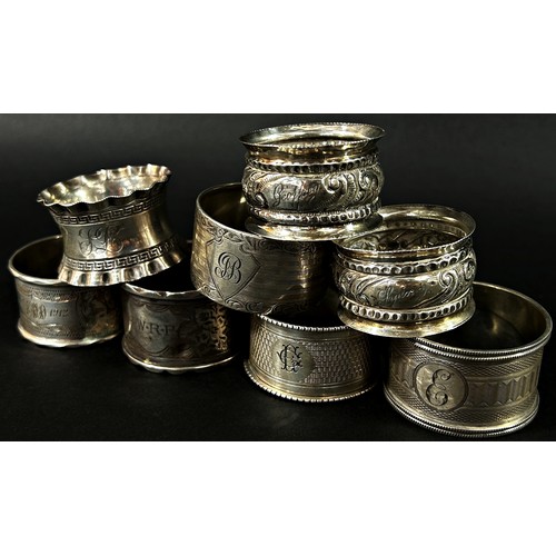 273 - A large mixed group of silver to include eight napkin rings, a silver mustard cup, a silver tankard,... 