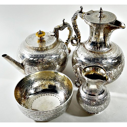 221 - An Aesthetic movement four piece silver plated tea and coffee set, with floral decoration amidst geo... 