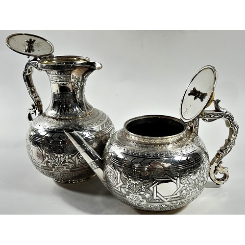 221 - An Aesthetic movement four piece silver plated tea and coffee set, with floral decoration amidst geo... 