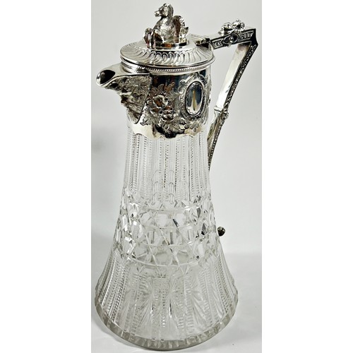 224 - A Regency style cut glass and silver plated claret jug with a Hippocampus to the lid and a dolphin t... 