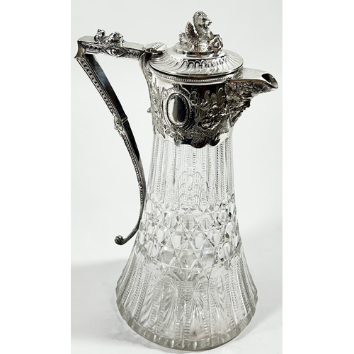 224 - A Regency style cut glass and silver plated claret jug with a Hippocampus to the lid and a dolphin t... 