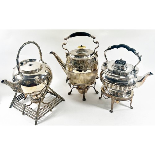 229 - Two Georgian style silver plated spirit kettles and a third Aesthetic style spirit kettle.