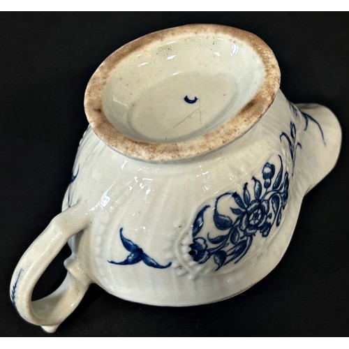 121A - An 18th century Worcester strap fluted sauce boat with floral detail, 16cm long