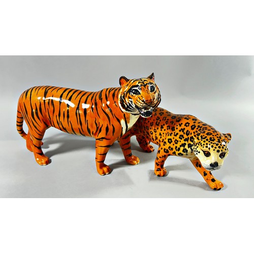 59 - Three Beswick figures; two leopards and a tiger, 30cm long and smaller (3)