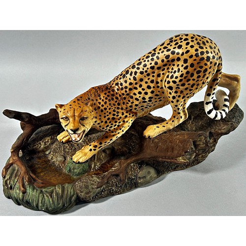 59 - Three Beswick figures; two leopards and a tiger, 30cm long and smaller (3)