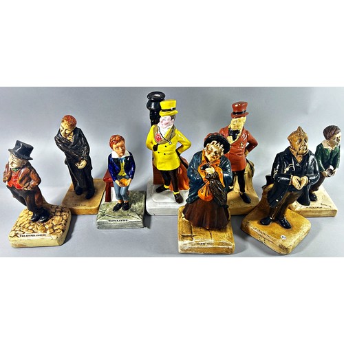 51 - A collection of 14 Bretby ware Dickens characters