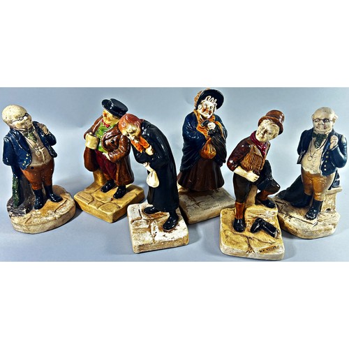 51 - A collection of 14 Bretby ware Dickens characters